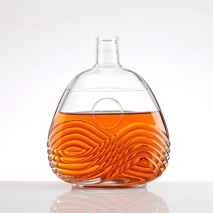 Transparent Bottle With Wavy Pattern And Silver Crown Cap